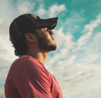 A man outside taking a deep breath to swiftly enhance his mental health