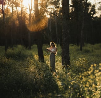 a woman standing in the middle of the forest reading a book instantly enhancing her mental health.