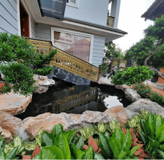 a bridge over a pond with a bridge over it