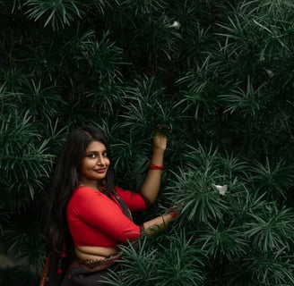 a woman in a red top and black pants