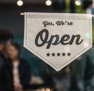 a sign that says yes we're open