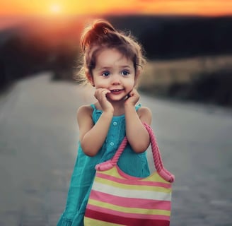 small girl with purse on dirt country road