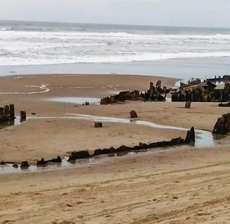 Oregon Coast - sunken steamship buried in the sand at Horsfall Beach, North Bend