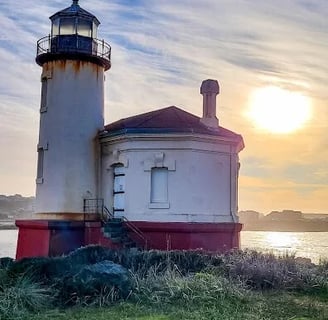 Oregon Coast - A lighthouse on a beach in Bandon