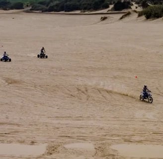 Oregon Coast -People on atv's & motorcycles on Winchester Bay's sand dunes