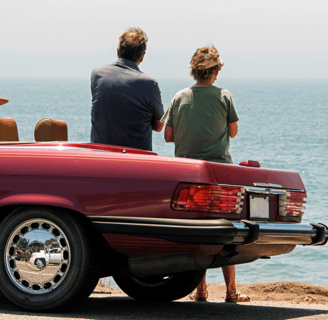 Mercedes SL parked by the ocean