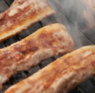 pancetta and bacon grilling on a bbq grill