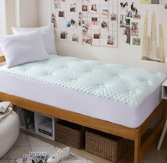a bed with a bed and a desk with a chair