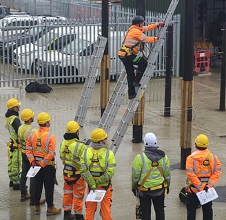 Our trainer demonstrating to class of trainees how to climb ladder safely