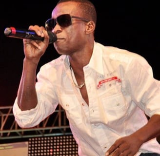 K.K Fosu singing on stage.