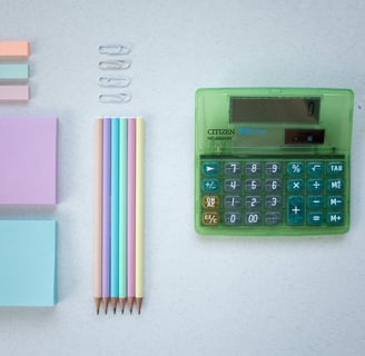 a calculator with a calculator and pencils