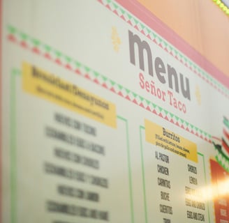 a menu board with a menu on it