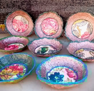 a group of vibrant color bowls with old paperwall