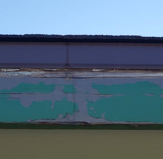 Rotting fascia board underneath drip edge. 