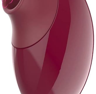 a red and purple object with a cat on it