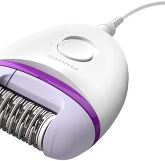 a close up of a white and purple electric shaver