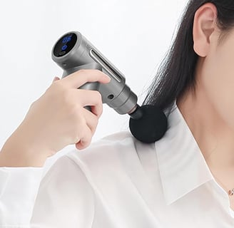 a woman is using a hair dryer