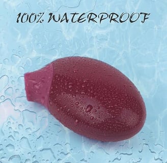 a red object in the water with water droplets on the surface