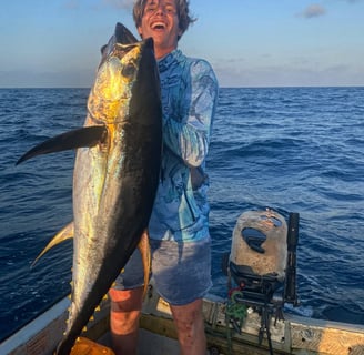 Fisherman holding a large Yellowfin Tuna during a Full-Day Fishing Charter in Zanzibar