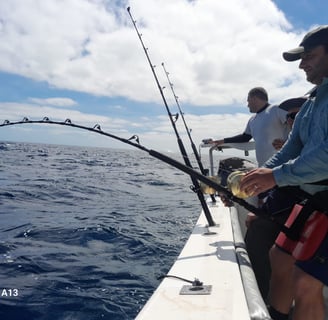 Anglers trolling on a catamaran - Catamaran Fishing Charters Seychelles