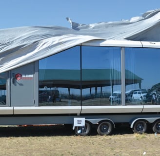 a large trailer with a large trailer attached to it