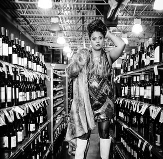 Keri Elle -woman in a dress and gogo boots is standing in a store- fur coat, captured by Taye Rose