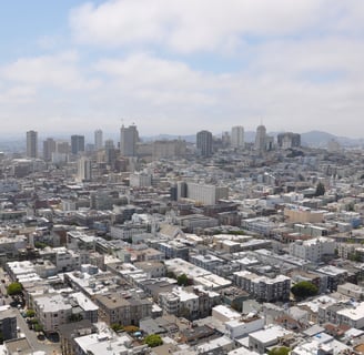 a city skyline view of san francisco with tall buildings