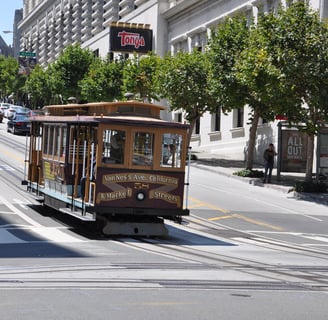 a trolley car on a city street in San Francisco