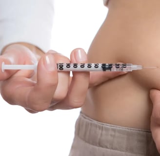 woman injecting weight loss medication in belly