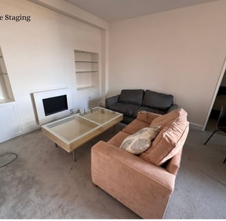 a living room with 2 sofas and oversized coffee table