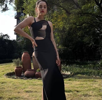 Fashion influencer cynthia Scellos in a black cutout dress from Bella Barnett_ night out dress first