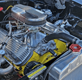 A engine compartment with complete detailing from D and P auto detailing