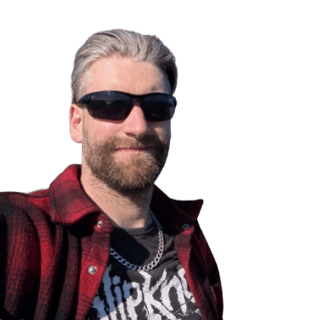 Ryan McCormack smiling with Sunglasses on