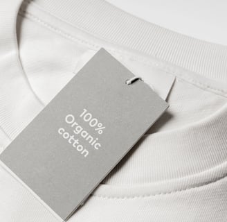 white t-shirt with tag that says '100% organic cotton'