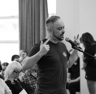A man singing into a microphone