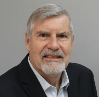a man with a beard and a white shirt