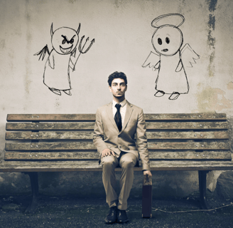 a man in a suit and tie is sitting on a bench
