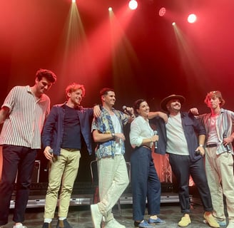 a group of people standing on a stage