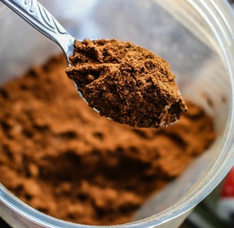 a spoon full of cocoa powder