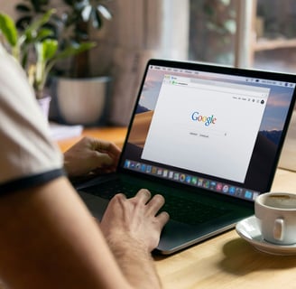person using google on laptop