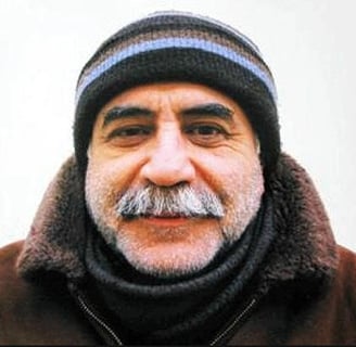 Kuddusi Okkır Kimdir