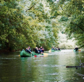 charente a group of people in canoes on a river