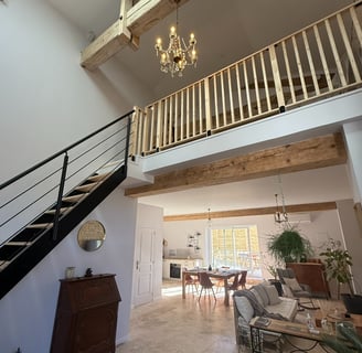 a living room with a staircase and a staircase