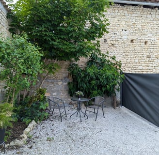 a patio with a table and chairs and a table