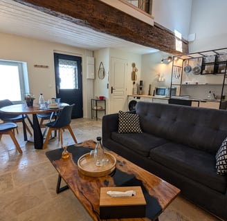 a living room with a couch and a table