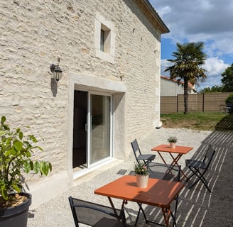 a table with chairs and tables outside