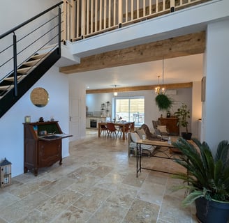 a living room with a staircase and a staircase
