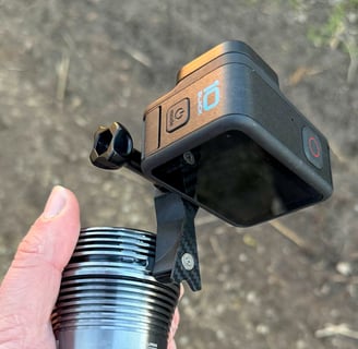 a person holding a camera and a light