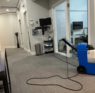 A carpet cleaning machine inside an office building.