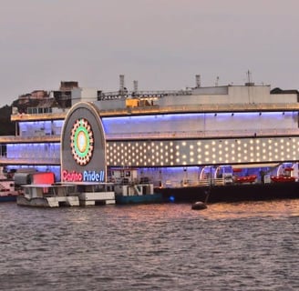 A casino ship in Goa with colorful lights and floating in the water